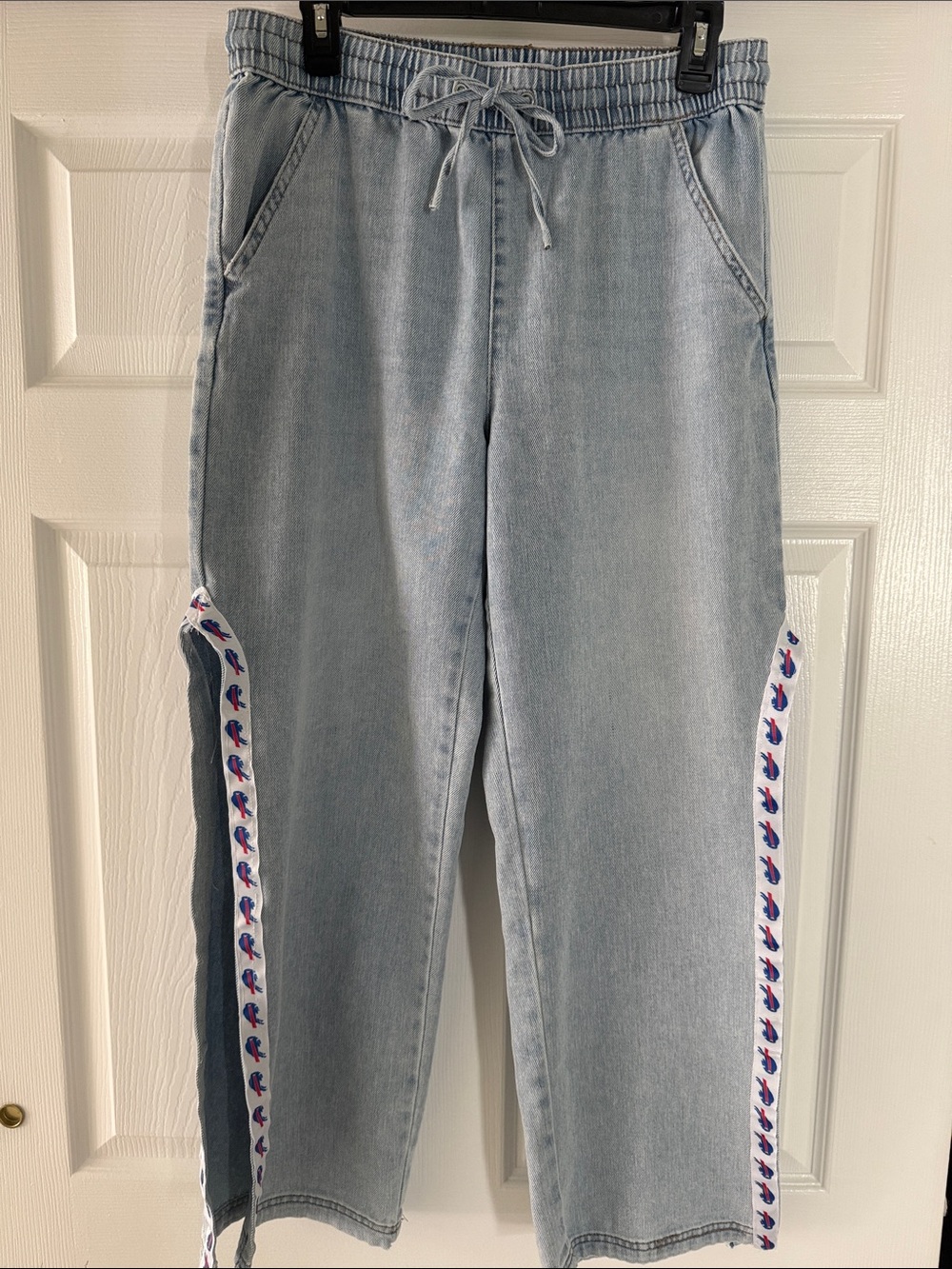 Upcycled, unique Light Wash Denim Jean with high slit and Buffalo Bills trim